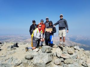 Group at the top of a mountain